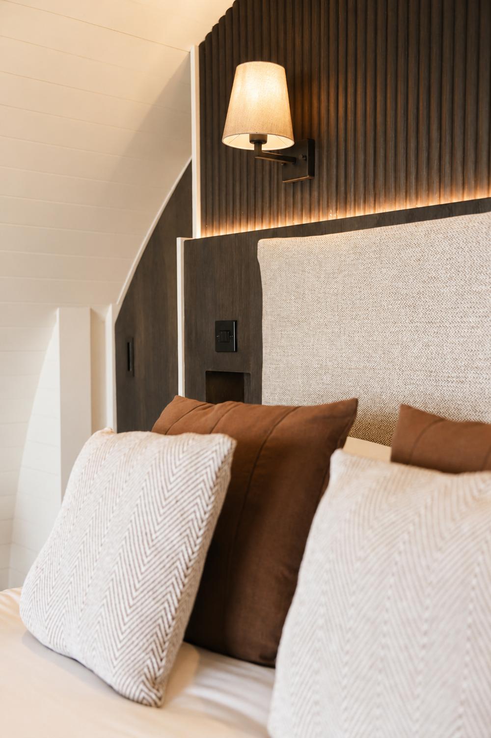 Detail of the cushions against the upholstered headboard
