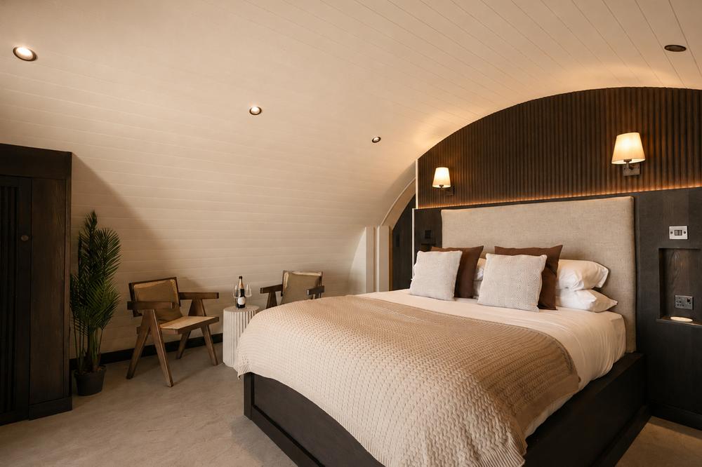 Bedroom seating area with wardrobe, chairs and champagne table