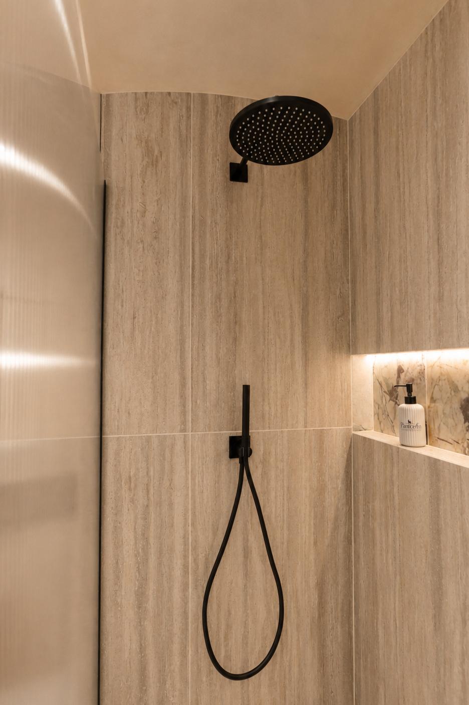 Rainfall shower head, hand shower and travertine tiling