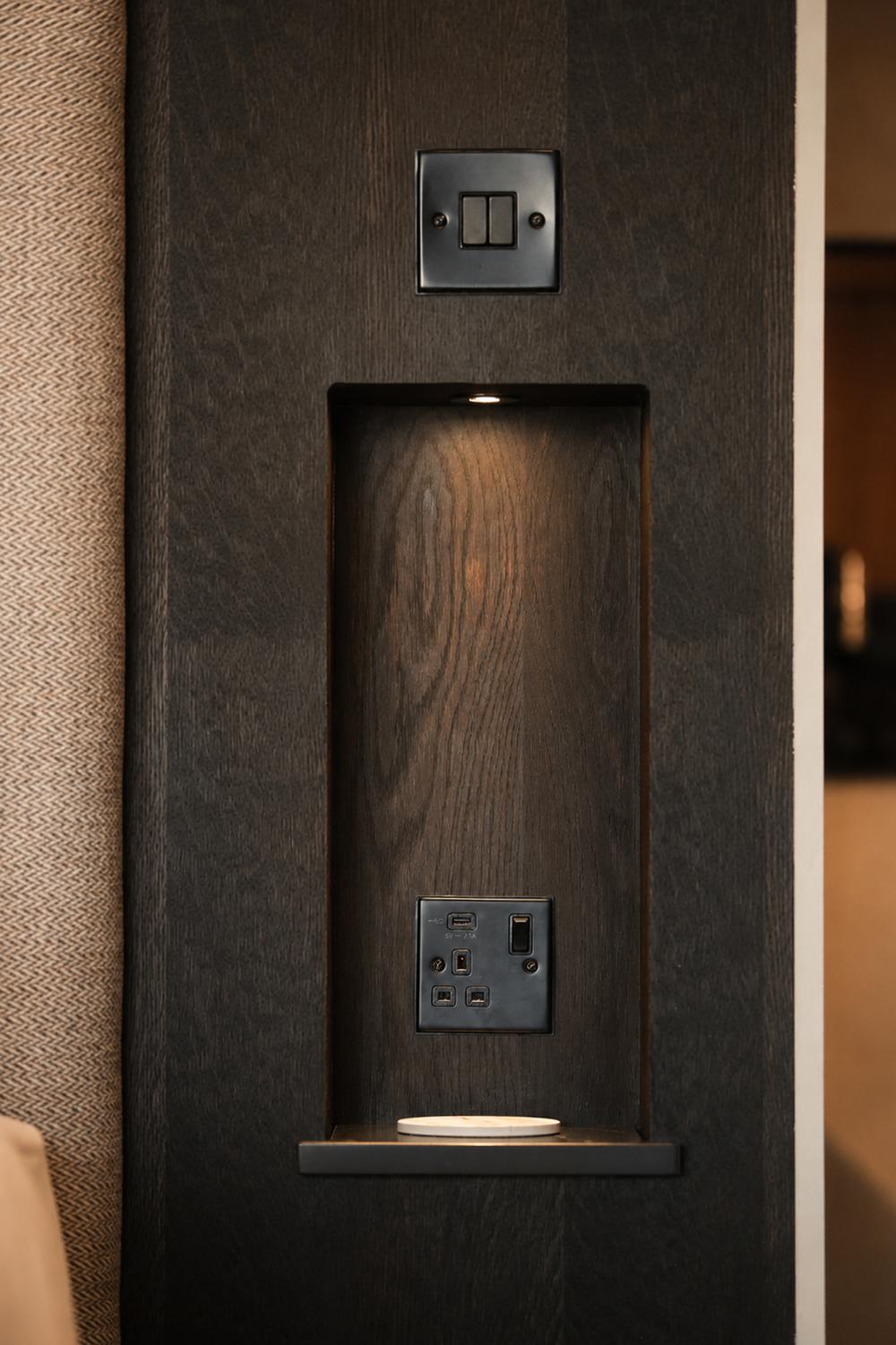 Detail of the in-wall USB charging point and lit display niche