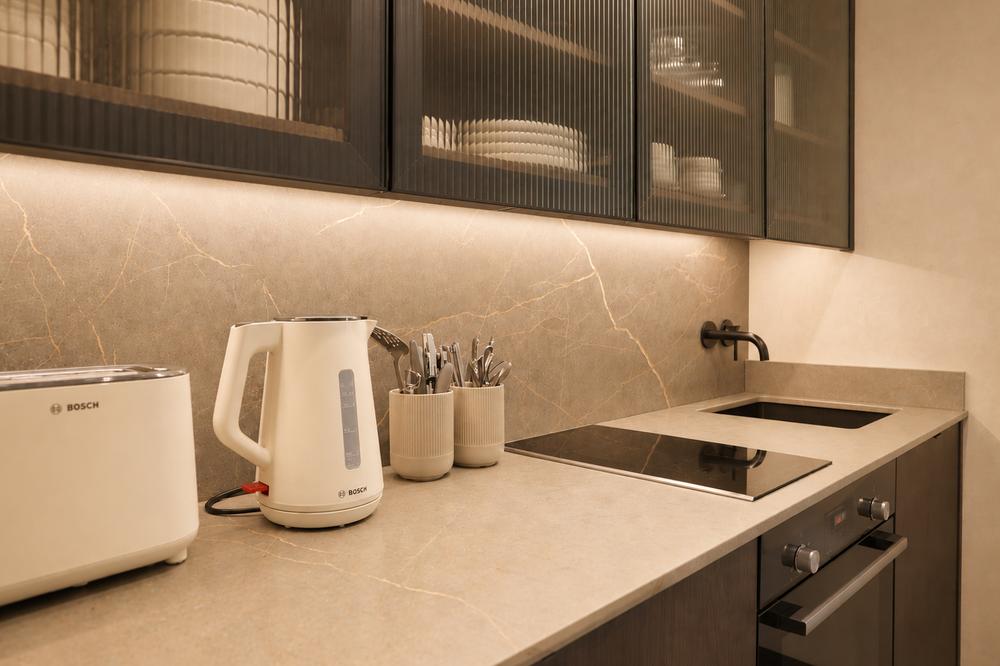 Kitchen counter with kettle, toaster and induction hob