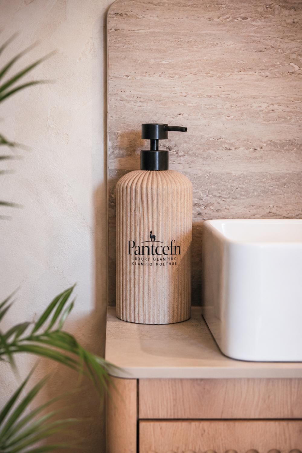 Pantcefn-branded soap dispenser on the bathroom vanity